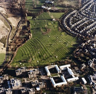 Oblique aerial view of Prestonfield centred on a golf course and rig, taken from the WNW.