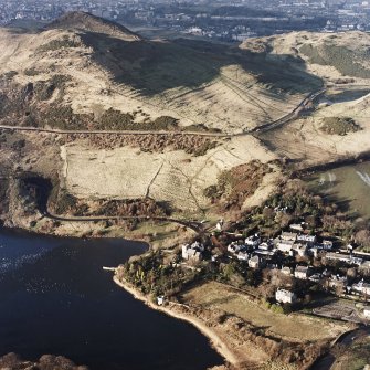 Oblique aerial view of Edinburgh, Holyrood Park centred on the remains of cultivation terraces, taken from the ESE.