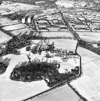 Oblique aerial view of Craigmillar Castle centred on the castle, taken from the SSE.