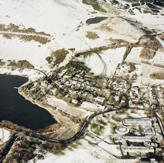 Oblique aerial view of Edinburgh, centred on Holyrood Park, taken from the SE.