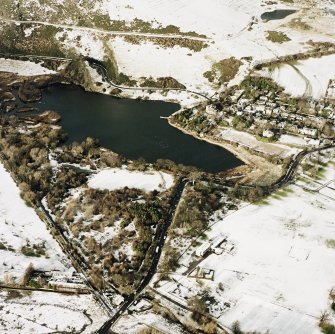 Oblique aerial view of Edinburgh, centred on Holyrood Park, taken from the SE.