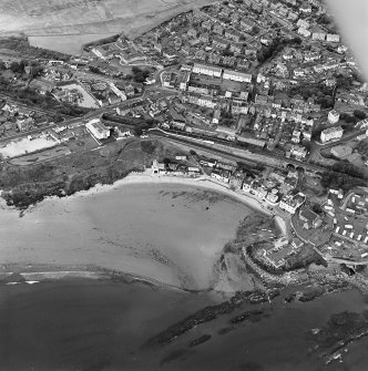 Oblique aerial view of Kinghorn centred on the harbour, taken from the WSW.