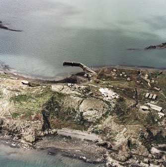 Oblique aerial view of Inchkeith Island centred on the defences, taken from the NE.