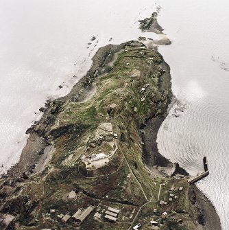 Oblique aerial view of Inchkeith Island centred on the defences, taken from the NW.