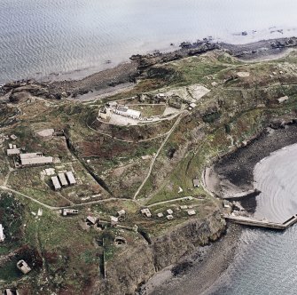 Oblique aerial view of Inchkeith Island centred on the defences, taken from the W.