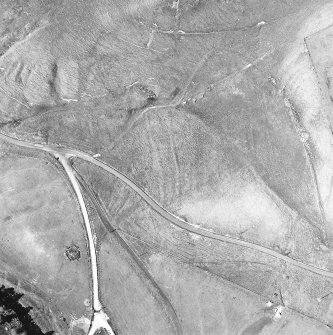 Oblique aerial view centred on the remains of the possible field-system, taken from the SW.