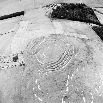 Oblique aerial view centred on the remains of the fort, taken from the NE.