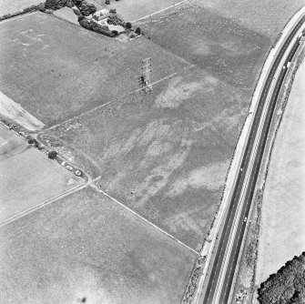 Newton, oblique aerial view, taken from the S, centred on the cropmark of a pit alignment. Monkton House is visible in the top half of the photograph.