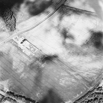 Thornybank, oblique aerial view, taken from the SE, centred on cropmarks, including a ring-ditch.