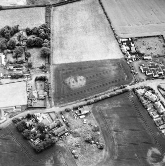 Hope Cottage, oblique aerial view, taken from the NNW, centred on the cropmarks of a possible enclosure.