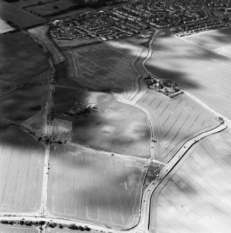 Oblique aerial view of Longthorn centred on the remains of coal pits and cropmarks, taken from the E.