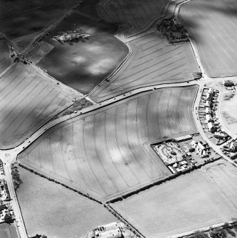 Oblique aerial view of Longthorn centred on the remains of coal pits and cropmarks, taken from the NE.