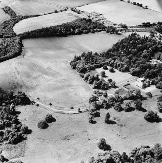 Oxenfoord Castle, linear cropmarks and cropmarks: oblique aerial view, taken from the NE, centred on cropmarks of a possible formal garden and linear cropmarks. Oxenfoord Castle is visible in the centre right of the photograph.