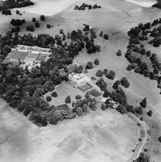Oxenfoord Castle, linear cropmarks and cropmarks: oblique aerial view, taken from the SSE, showing cropmarks of a possible formal garden and linear cropmarks in the foreground. Oxenfoord Castle is visible in the centre of the photograph.