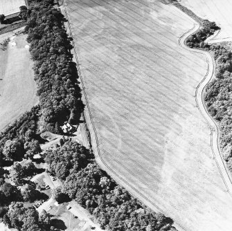 Vogrie Grange, oblique aerial view, taken from the NE, centred on the cropmark of a possible settlement. The West Lodge, Vogrie House is visible in the centre left half of the photograph.