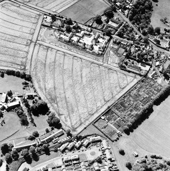 Oblique aerial photograph of Inveresk, taken from the NNE, centred on the cropmarks of a field system.