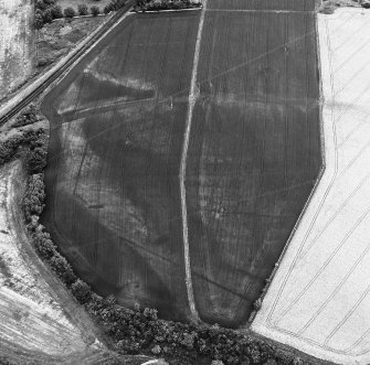 Inveresk: oblique air photograph of Roman temporary camps, enclosure, long cist cemetery, soilmarks and mineral railway