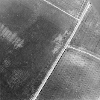 Barbachlaw, oblique aerial view, taken from the E, centred on cropmarks which include those of an enclosure, a possible enclosure, and cultivation remains.