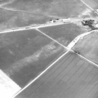 Dolphingstone, oblique aerial view, taken from the SSE, centred on a series of cropmarks.