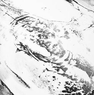 Kirktonhill, oblique aerial view, taken from the WNW, centred on the snow-covered fort.