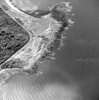 Oblique aerial view of Gosford Sands centred on the remains of anti-tank blocks, taken from the NNE.