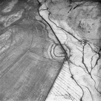 Adderston Lee, oblique aerial view, taken from the SW, showing a fort in the centre of photograph. Immediately to the ENE and S of the fort, rig is visible.