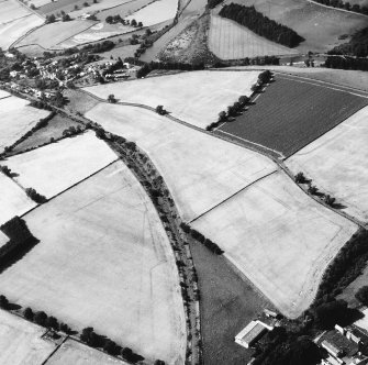 Newstead, Roman fort and temporary camps: air photograph showing Southern annexe (NT 569 341), Eastern annexe (NT 572 343), annexe (NT 571 343), and 40- and 160-acre temporary camps (NT 570 337 and NT 570 344 respectively).
