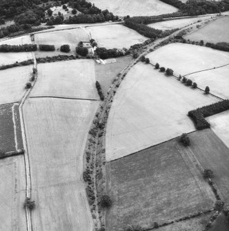 Newstead, Roman fort and temporary camps: air photograph showing Southern annexe (NT 569 341), 'Great camp' complex of temporary camps (NT 574 341), and 40- and 160-acre temporary camps (NT 570 337 and NT 570 344 respectively).

