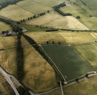 Newstead, Roman fort and temporary camps: air photograph showing Eastern annexe (NT 572 343), Southern annexe (NT 569 341), Western annexe (NT 569 341), annexe (NT 571 343), and possible annexe (NT 569 342).
