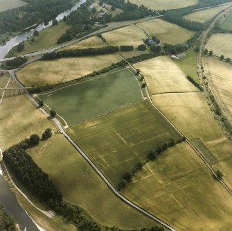 Newstead, Roman fort and temporary camps: air photograph showing Eastern annexe (NT 572 343), Southern annexe (NT 569 341), Western annexe (NT 569 341), annexe (NT 571 343) and possible annexes (NT 569 342 and NT 570 346).
