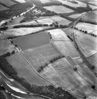 Newstead, Roman fort and temporary camps: air photograph showing Eastern annexe (NT 572 343), Southern annexe (NT 569 341), Western annexe (NT 569 341), annexe (NT 571 343) and possible annexes (NT 569 342 and NT 570 346).
