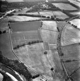 Newstead, Roman fort and temporary camps: air photograph showing Eastern annexe (NT 572 343), Southern annexe (NT 569 341), Western annexe (NT 569 341), annexe (NT 571 343) and possible annexes (NT 569 342 and NT 570 346).
