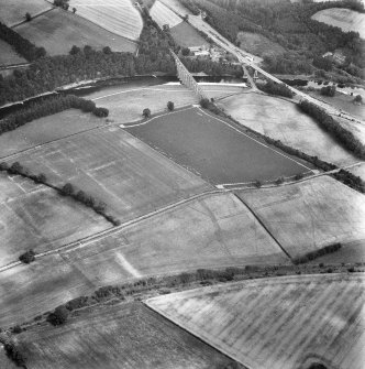 Newstead, Roman fort and temporary camps: air photograph showing Eastern annexe (NT 572 343), Southern annexe (NT 569 341), Western annexe (NT 569 341), annexe (NT 571 343), possible annexes (NT 569 342 and NT 570 346), and 160-acre temporary camp (NT 567 337).
