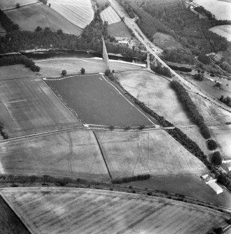Newstead, Roman fort and temporary camps: air photograph showing Eastern annexe (NT 572 343), Southern annexe (NT 569 341), Western annexe (NT 569 341), annexe (NT 571 343), possible annexes (NT 569 342 and NT 570 346), and 160-acre temporary camp (NT 567 337).
