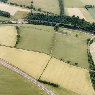 Newstead, oblique aerial view, taken from the SSE, centred on the Roman fort eastern annexe and 'great camps' complex.