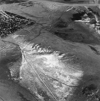 Oblique aerial view of Kelphope Burn centred on the fort and settlement, taken from the NW.