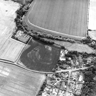 Preston Mill, oblique aerial view, taken from the NW, centred on cropmarks including a possible settlement. Preston Mill is visible in the centre of the photograph.