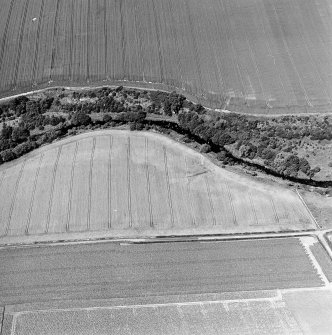 Oblique aerial view of Hailes Smithy centred on the cropmark of a possible enclosure.  Taken from the SSE.