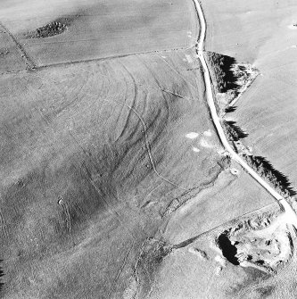 Aerial view of the route of the Wheel Causeway, centred on 6010 0861, and rig, taken from the SSW.