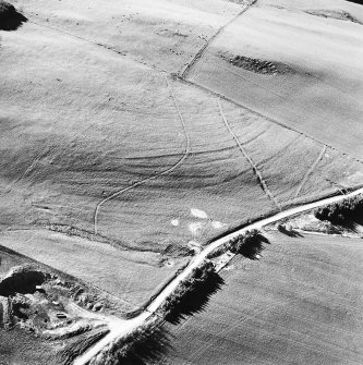 Aerial view of the route of the Wheel Causeway, centred on 6010 0861, and rig, taken from the ESE.
