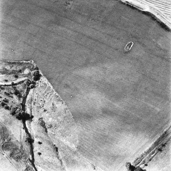 Cappuck, oblique aerial view, taken from the ENE, centred on the cropmark of an enclosure.