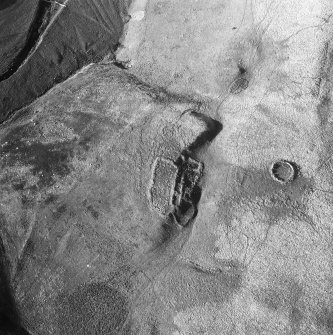 Crystal Knowe, deserted farmstead: oblique air photograph under conditions of shadow.
