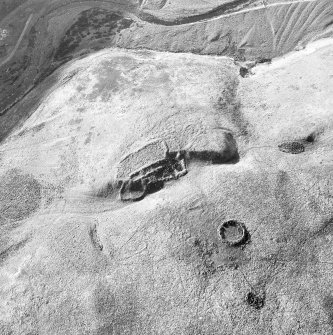 Crystal Knowe, deserted farmstead: oblique air photograph under conditions of shadow.
