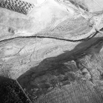 Birkcleuch, farming remains: oblique air photograph under conditions of shadow.
