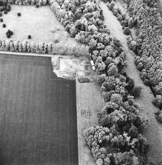 Oblique aerial view centred on the excavation of the fort, taken from the SW.