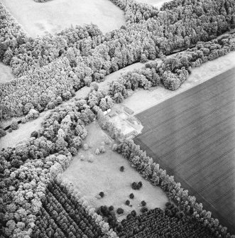 Oblique aerial view centred on the excavation of the fort, taken from the NNE.