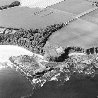 Oblique aerial view centred on the excavation of the chapel and cemetery, taken from the NNE.