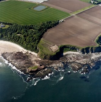 Oblique aerial view centred on the excavation of the chapel and cemetery, taken from the NNE.