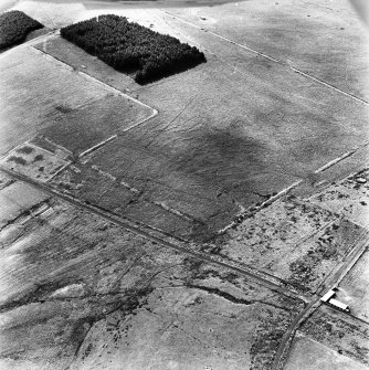 Pennymuir, oblique aerial view, taken from the NE, centred on two Roman Temporary Camps and a linear earthwork. An area of rig and the course of 'Dere Street' are visible in the bottom left-hand corner of the photograph.