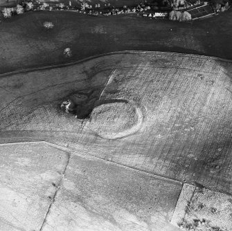 Oblique aerial view centred on the remains of the fort and quarry, taken from the WNW.